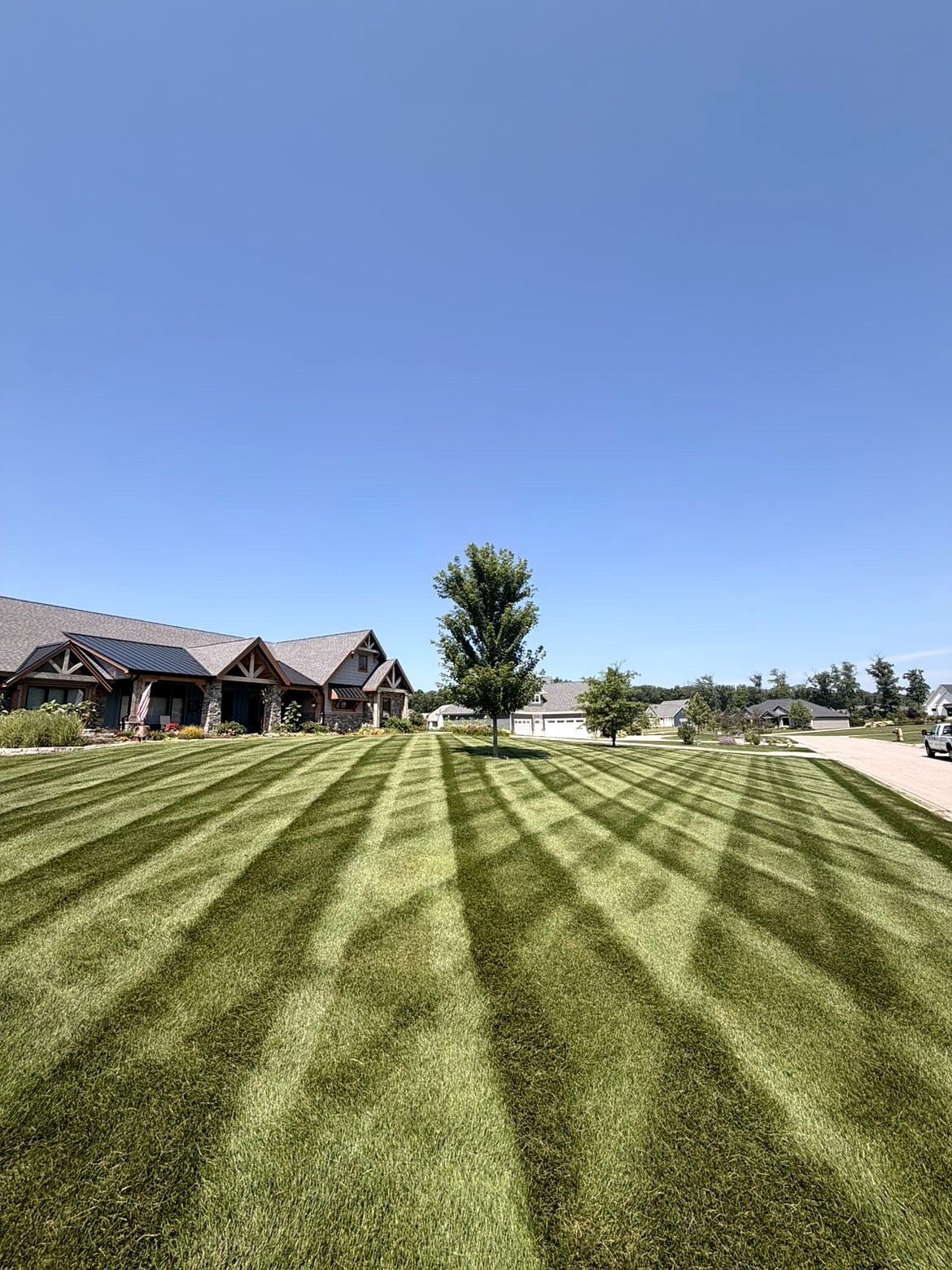 Detailed mowing and striping along a neighborhood property