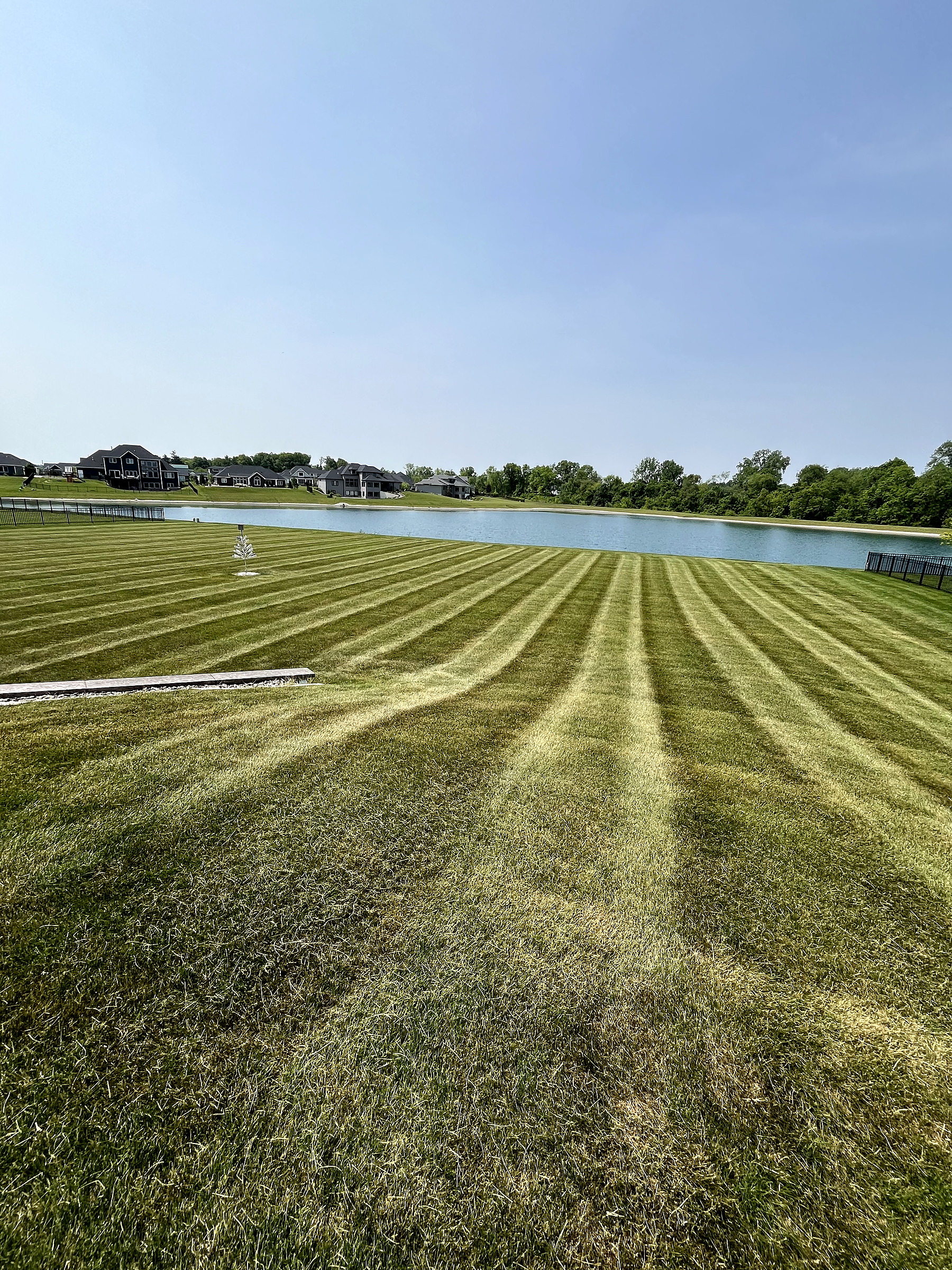 Large-property mowing with long, consistent stripes